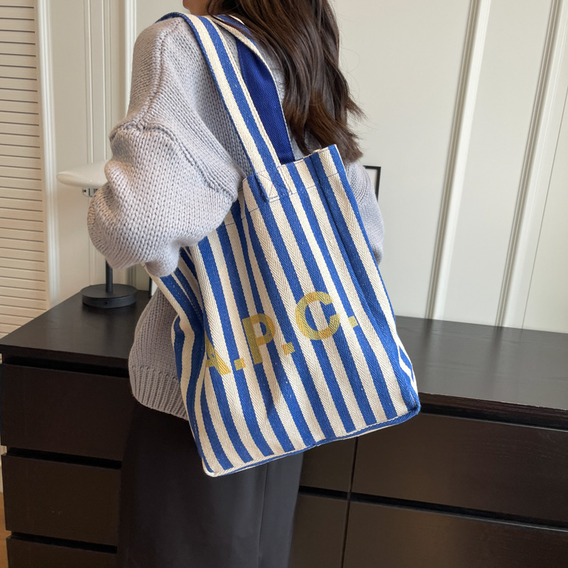 Commuter large-capacity striped canvas bag, 2024 new style women's bag, popular and versatile single-shoulder bag, college student tote bag details Picture