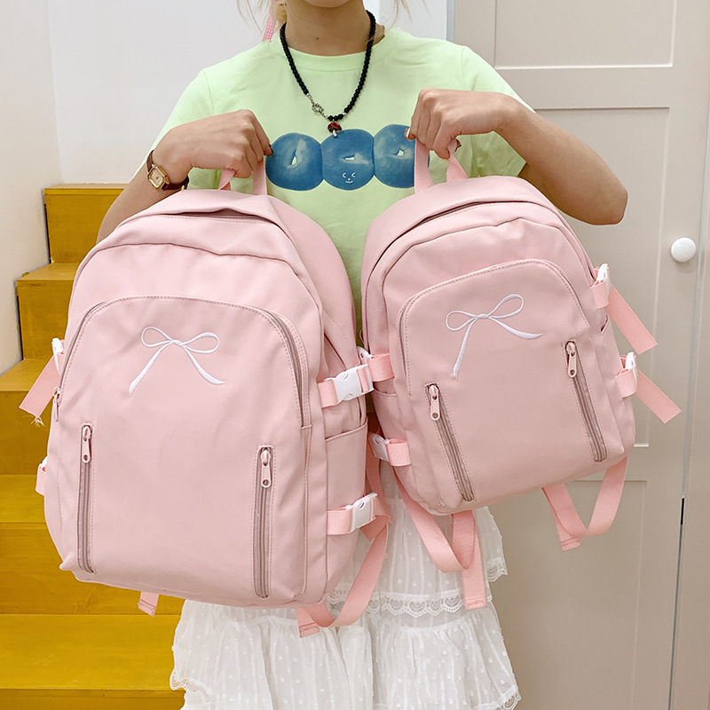 2025 New Japanese-style cute Korean-style versatile middle and high school schoolbag, casual and simple solid color bow backpack details Picture