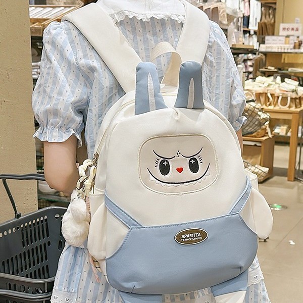 A new high-appeal, fresh, sweet and cute cartoon backpack with contrasting colors for children in grades 3 to 6, featuring a large capacity full figure