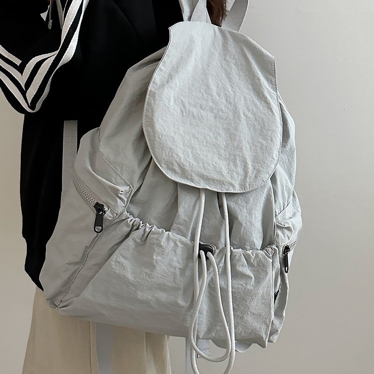 A new Korean niche lightweight nylon fabric backpack for girls, a casual and fashionable drawstring travel backpack with large capacity details Picture