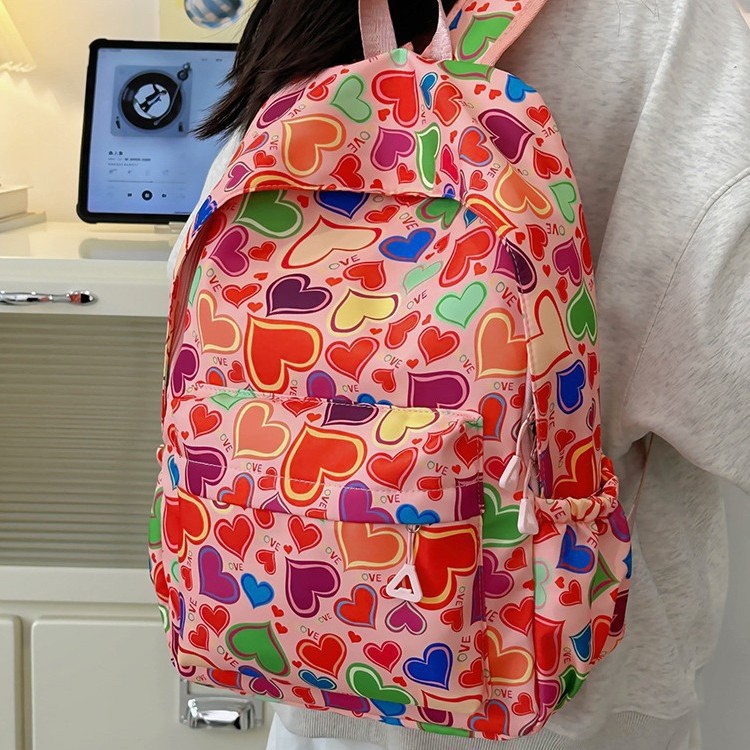 The 2025 new high-appeartion-level strawberry print backpack is a fashionable travel backpack for girls and a schoolbag for junior and senior high school students details Picture