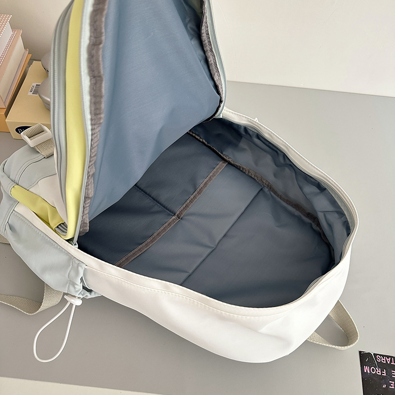 Korean macarons are cute and versatile. Junior high school schoolbag, girl's stylish color-blocking backpack, high appearance level high school student backpack Application Scenario