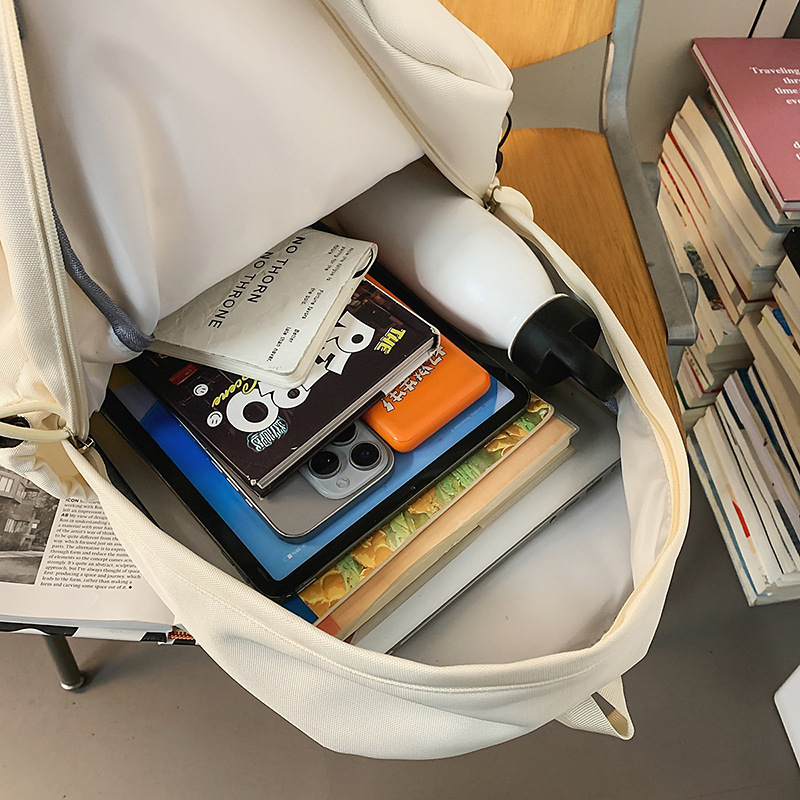 A new high-look, solid-color, simple backpack from the Korean version of Instagram. It's a casual, lightweight, versatile and large-capacity backpack for couples Application Scenario