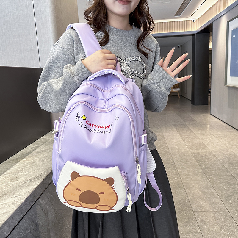 2025 Primary and Secondary School Students' printed irregular-shaped Kapiba large-capacity lightweight student backpack for both men and women Application Scenario