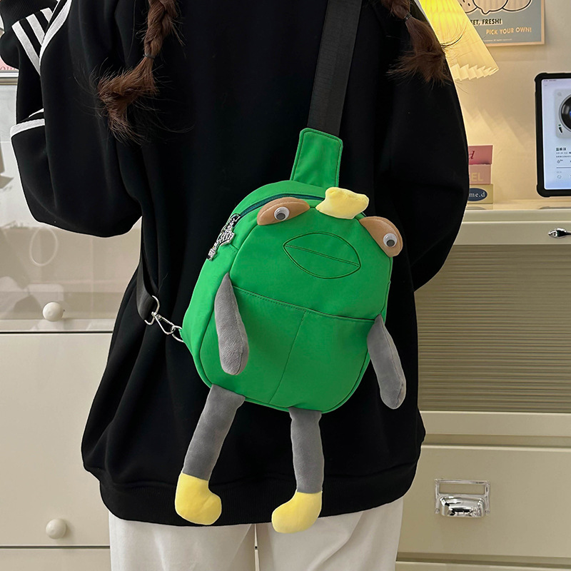 A cute and quirky Japanese cartoon crossbody bag for spring 2025, an ugly and adorable frog chest bag, and a unique mobile phone case full figure