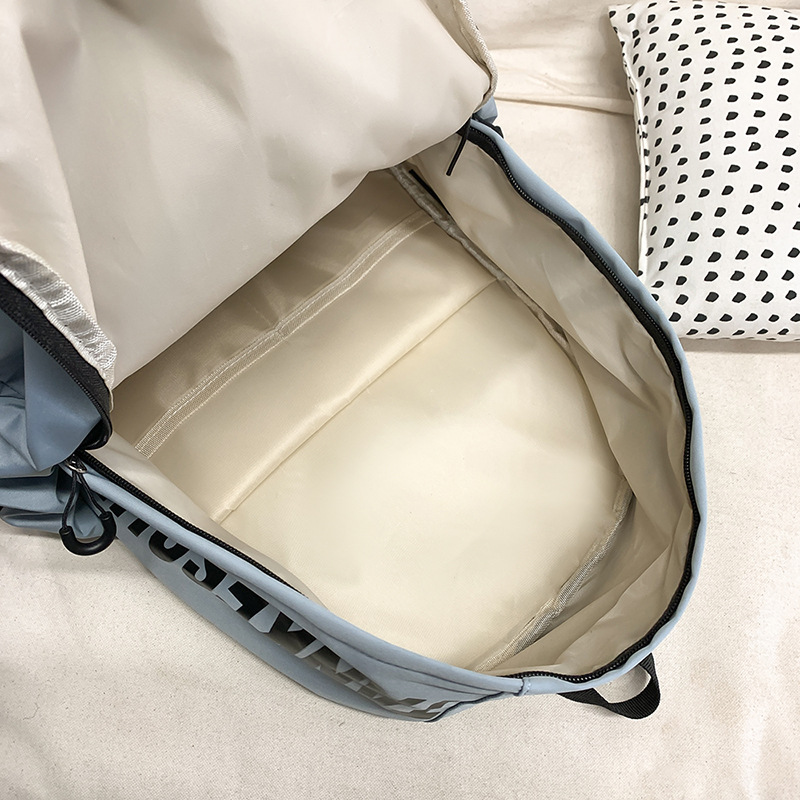 Japanese-style solid-color letter fashionable backpack, Korean-style college student lightweight schoolbag, large-capacity backpack for outdoor travel Application Scenario