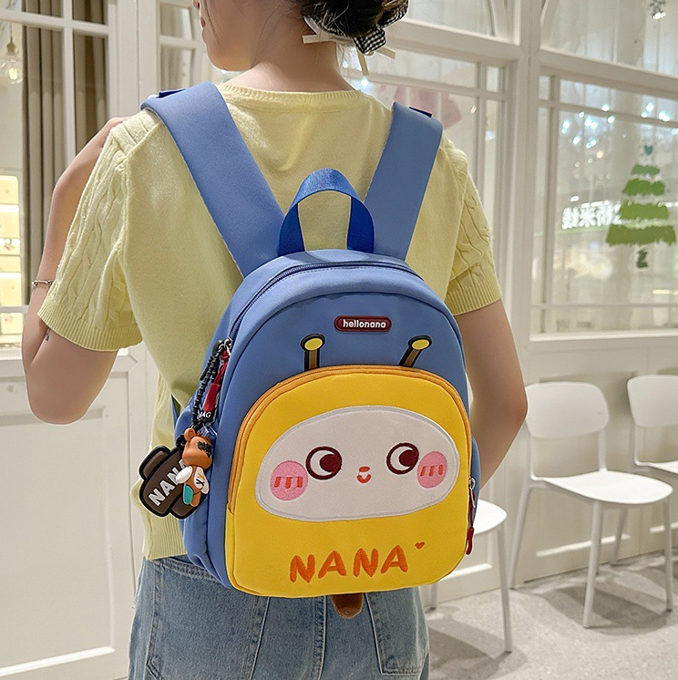 The new cartoon printed baby backpack for kindergartens in 2025 is a cute and lightweight backpack for boys and girls full figure