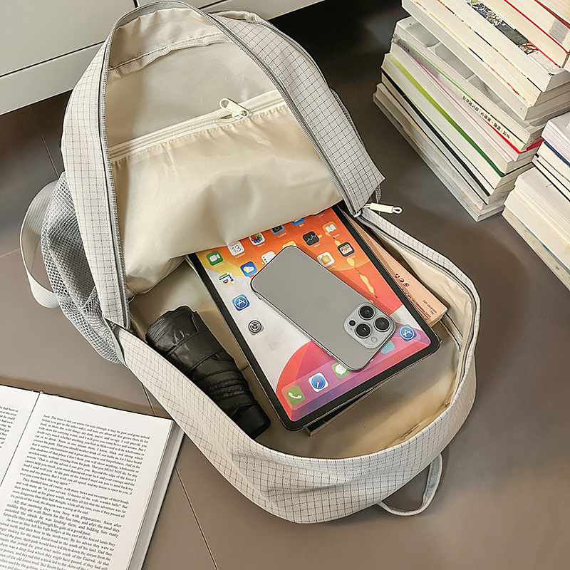 A new high-appeal Korean-style ins letter backpack for college students, featuring a simple and elegant design for mountain climbing and travel, with a large capacity on both shoulders Application Scenario