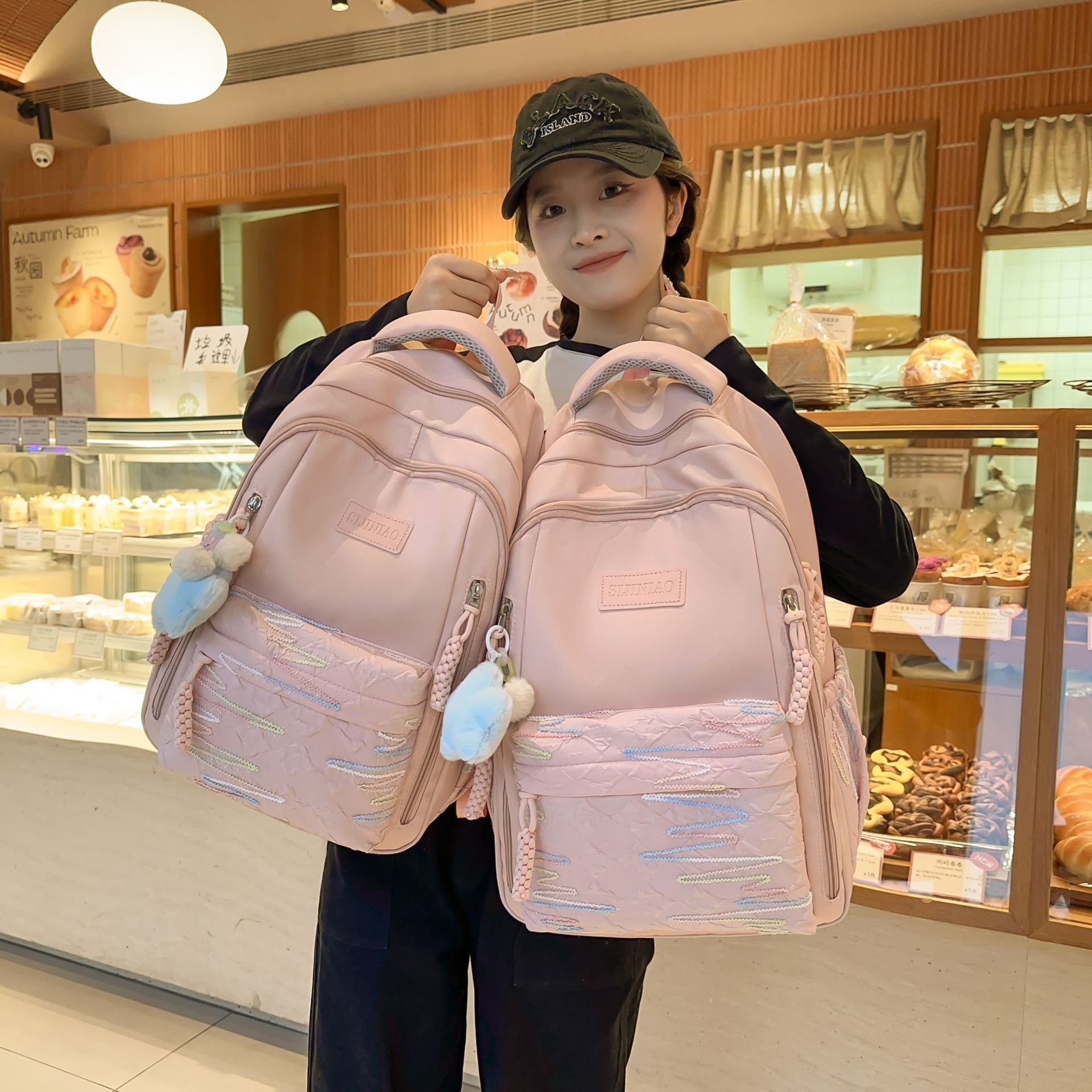 This Korean-style, fresh and cute backpack has a large capacity and a high level of appearance. It's an ins pink and tender backpack with a girlish heart for traveling and shopping full figure