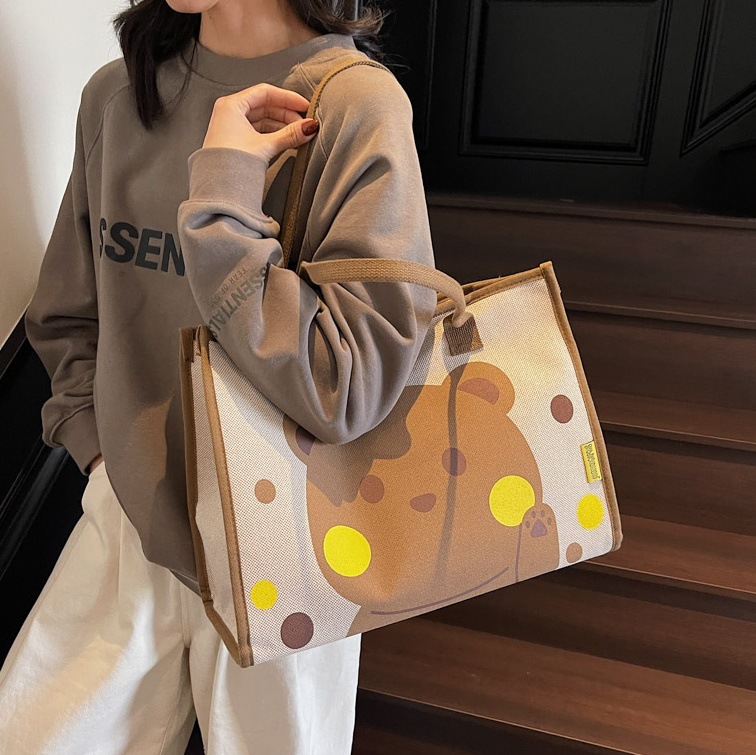 2025ins Japanese cartoon-printed single-shoulder bag, fashionable and casual tote bag, large-capacity commuting hand-held armpit bag full figure