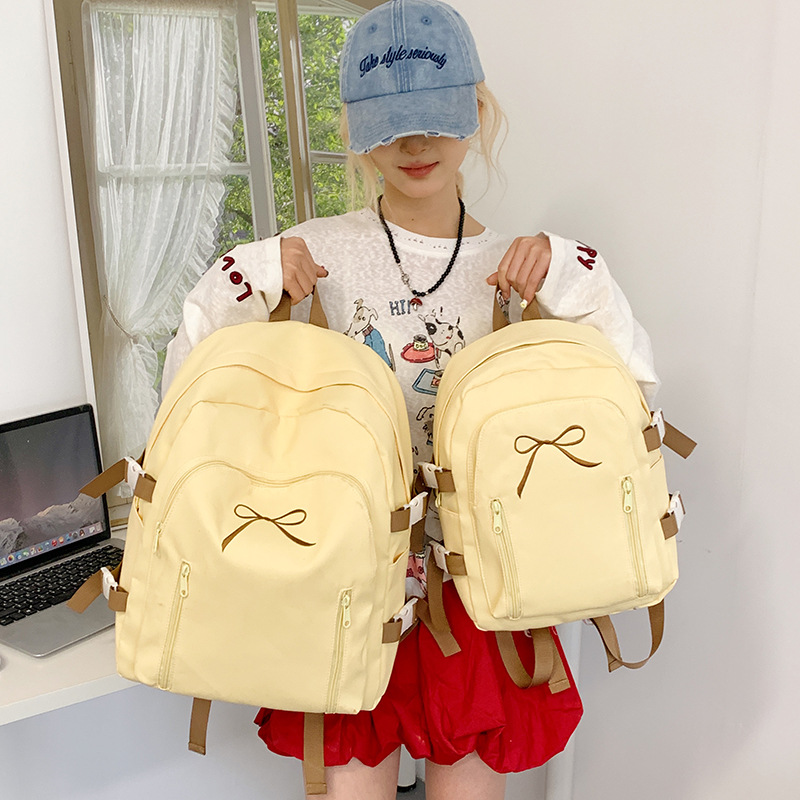 2025 New Japanese-style cute Korean-style versatile middle and high school schoolbag, casual and simple solid color bow backpack full figure