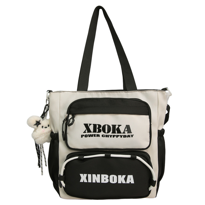 A new Korean-style backpack with a high aesthetic level and a college style, featuring letters, is a casual, simple, lightweight and versatile backpack for junior and senior high school students Item Picture