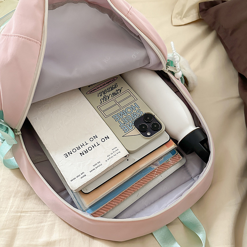 A new Korean-style Instagram backpack with a high level of appearance, fresh and sweet candy color, and a color-blocking double-shoulder bag for junior and senior high school students Application Scenario