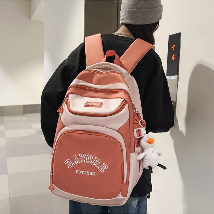 A simple and versatile travel backpack for female college students in Korean style, a large-capacity backpack for high school students with a masculine feel full figure