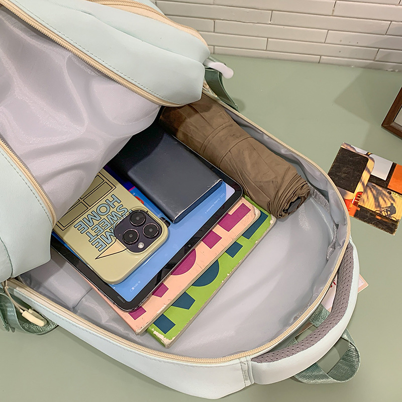 A new high-appearance-level Japanese ins fresh and sweet candy-colored color-blocking backpack with large capacity for junior and senior high school students Application Scenario