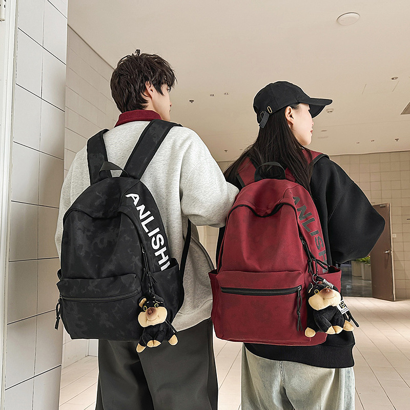 The 2025 new American-style retro large-capacity schoolbag, simple and versatile printed backpack, is a casual and lightweight backpack for going out full figure