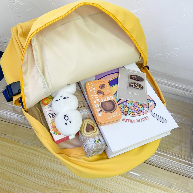 A Japanese-style Instagram backpack with a high level of appearance and solid color letters for junior and senior high school students. It is a casual, simple and large-capacity backpack Application Scenario