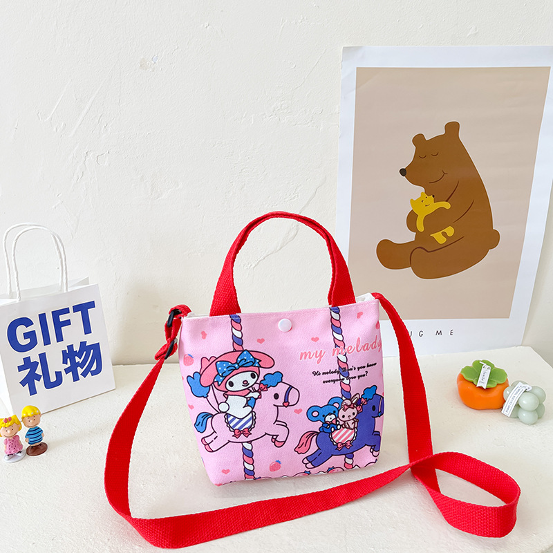 A cute girl's crossbody bag with comic graffiti, a large-capacity phone bag for parents and children, and a stylish canvas handbag for kids details Picture