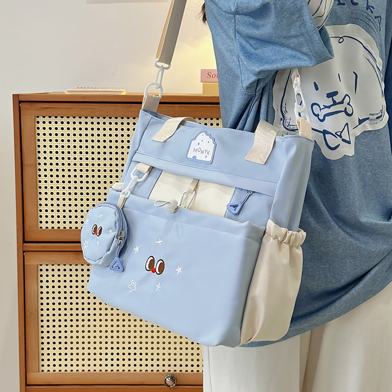 2025 New Korean version large-capacity student commuting and make-up class bag, simple and casual college style handbag, versatile backpack details Picture