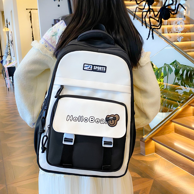 Korean-style schoolbag for girls, large-capacity middle school backpack with cute bear prints, and backpack for boys in grades three and four full figure