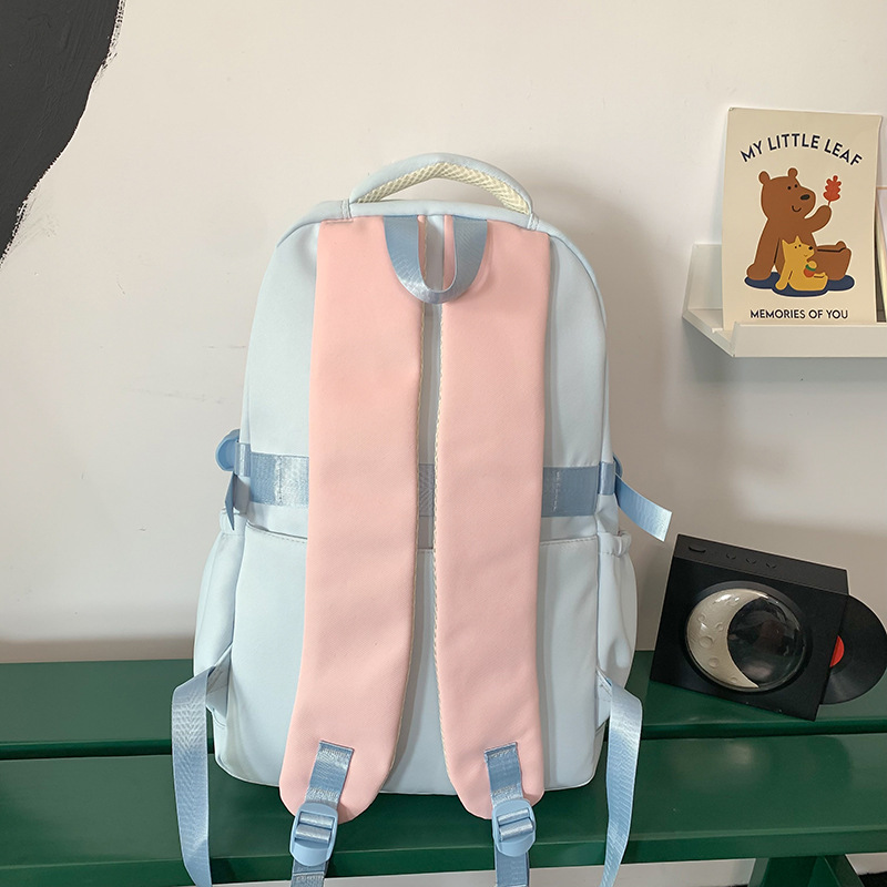 A new Korean-style college student couple casual backpack with a high appearance level. It is a multi-layered backpack for teenagers and students Application Scenario