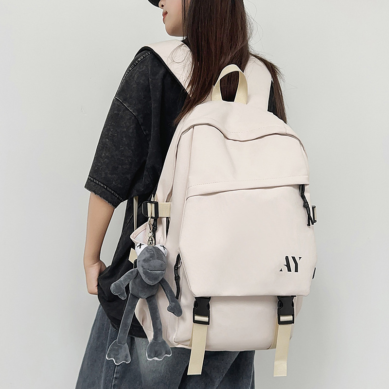 A new high-appeal, niche design backpack from Korean Instagram. It's a simple, lightweight, and large-capacity backpack in a solid color for couples details Picture
