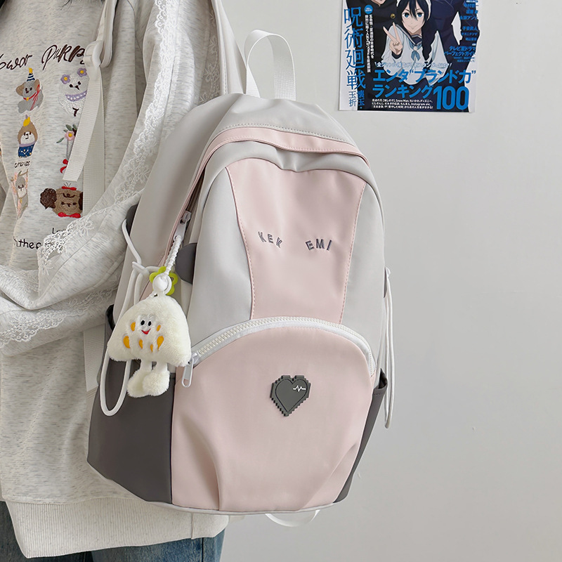 A cute color-blocking backpack for female college students in 2025, a large-capacity travel backpack for junior and senior high school students details Picture