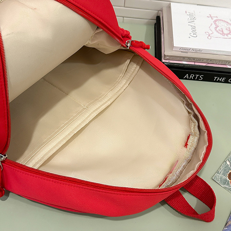 2025 New cute Apple backpack, cartoon large-capacity student schoolbag, travel, leisure and commuting lightweight backpack Application Scenario