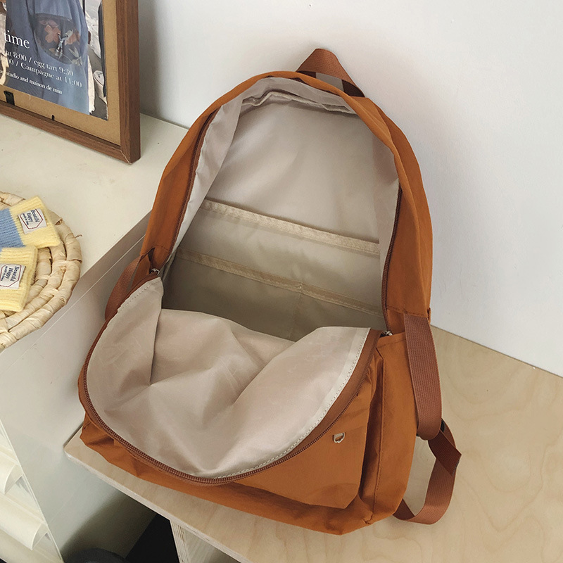 2025 New Japanese ins simple and versatile solid color backpack, lightweight and trendy backpack, casual schoolbag for grades 1-6 Application Scenario