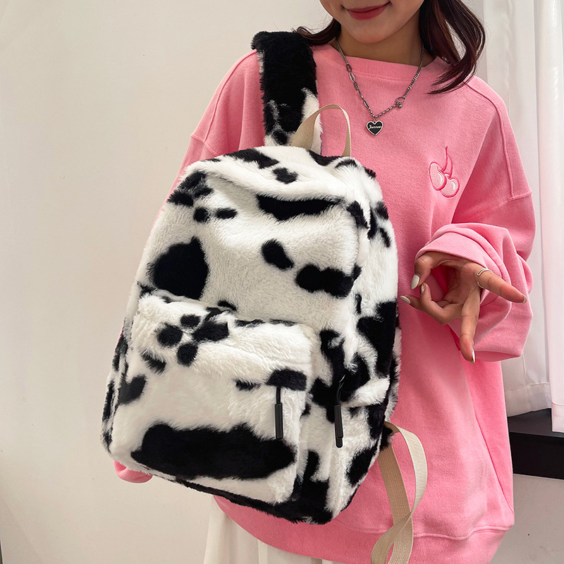 Plush cow, hot girl, high appearance level, large capacity schoolbag for girls in autumn and winter, fluffy girl backpack, cute and casual backpack full figure