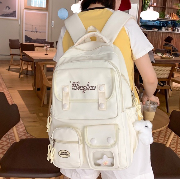 A soft and fresh schoolbag with a Korean school style, a multi-layered design, and a solid color backpack for female junior high school students full figure