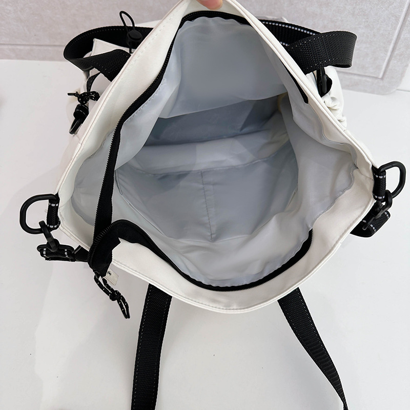 Large-capacity student tutorial bags, hand-carried bags, junior and senior high school students, college students, high appearance level, single-shoulder crossbody bags, women Application Scenario