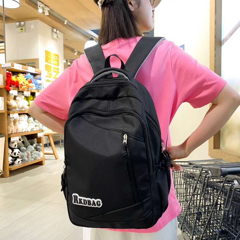 The 2024 new simple and casual middle school backpack for men is trendy, lightweight and versatile. It's a letter travel backpack for women details Picture