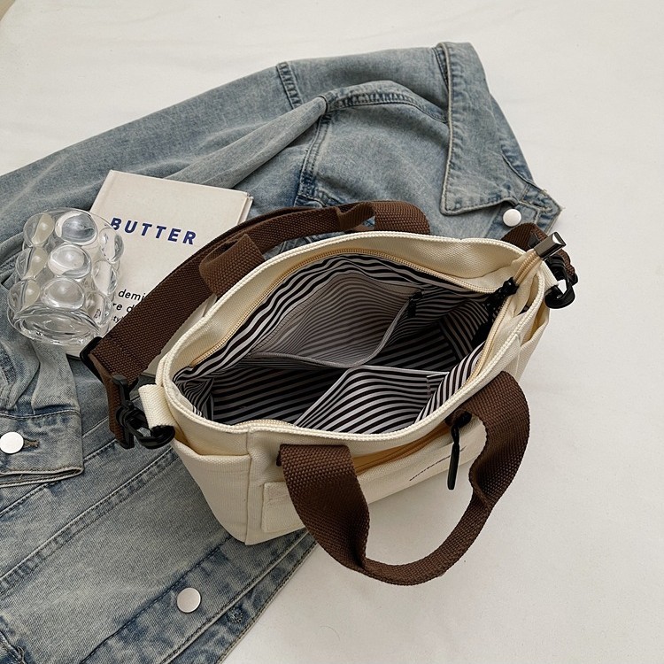 The 2025 new style of fashionable and casual canvas bag is versatile and has a large capacity. It is a niche handbag and a simple Korean-style commuter tote bag Specification drawing