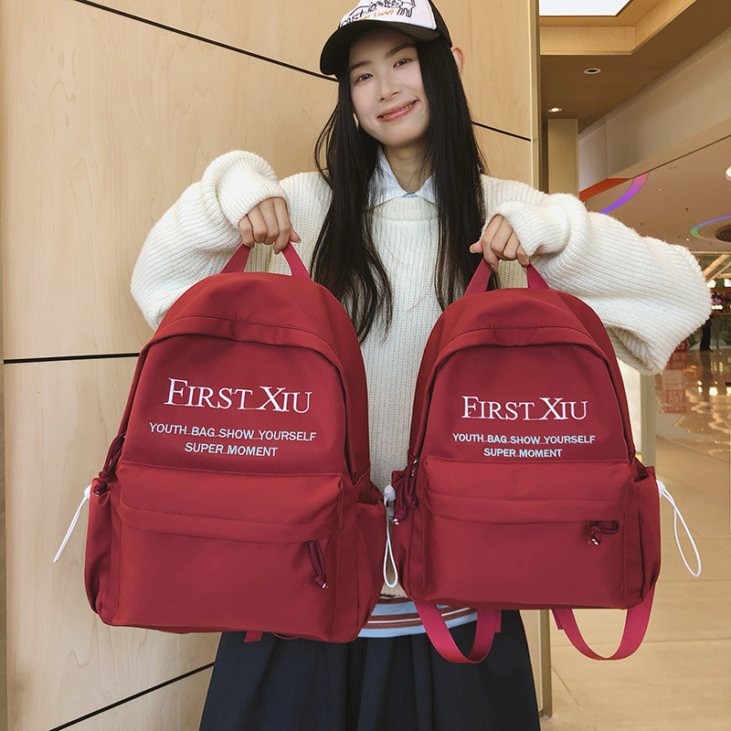 Korean InS-style versatile schoolbag for middle and high school students, solid color letter backpack, high appearance level, simple and lightweight backpack details Picture