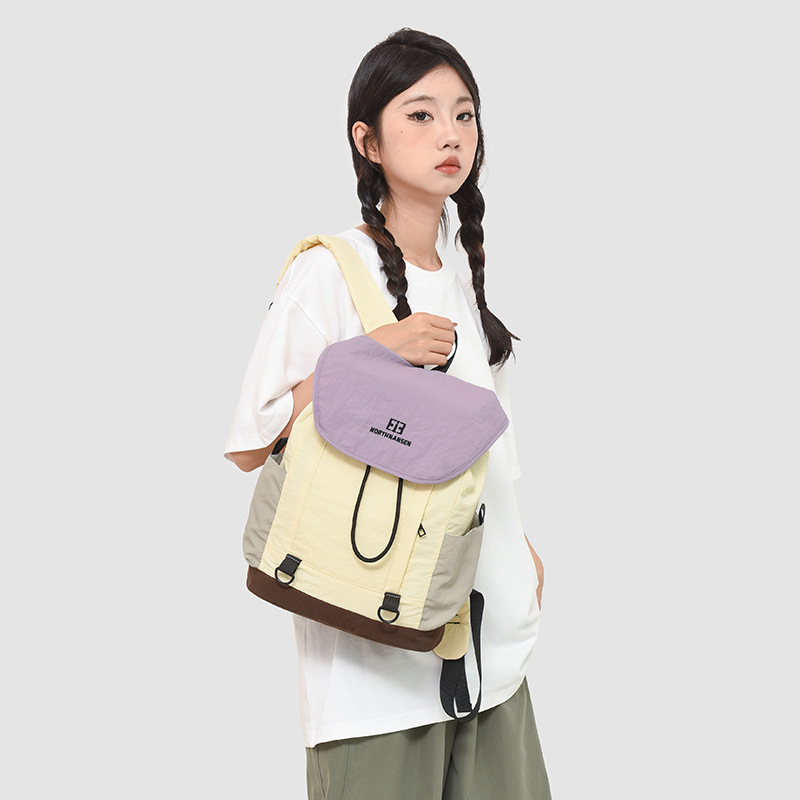 The 2025 new color-blocking backpack is a lightweight, casual and versatile backpack for junior and senior high school students as a couple. It is also suitable for traveling details Picture