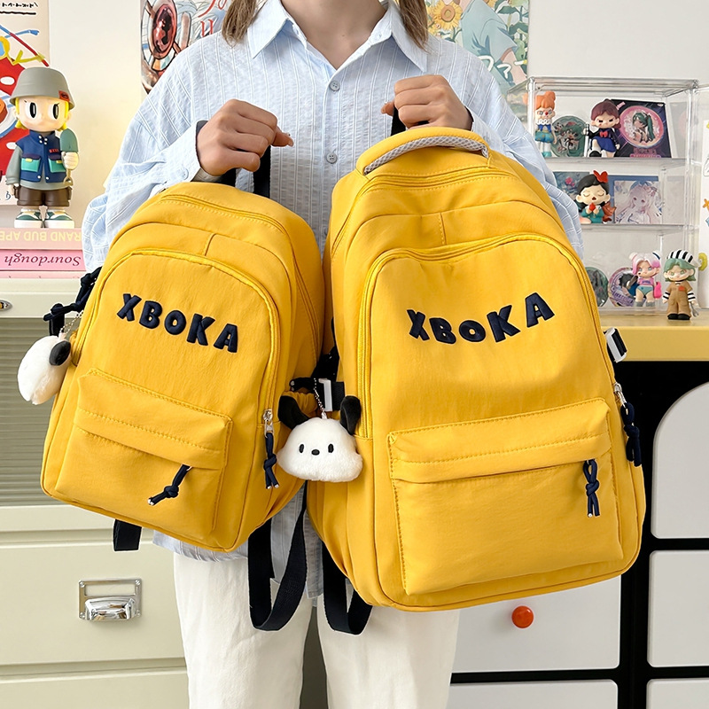 A new Korean-style Instagram backpack with a high aesthetic level, fresh and sweet candy color, and a simple and lightweight backpack for junior and senior high school students full figure