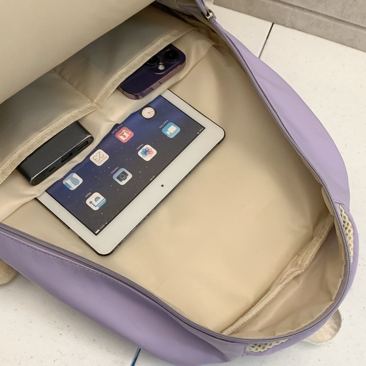 A new Korean-style ins school-style versatile and cute backpack with a color-blocking and patchwork design, a lightweight backpack for primary and secondary school students Application Scenario