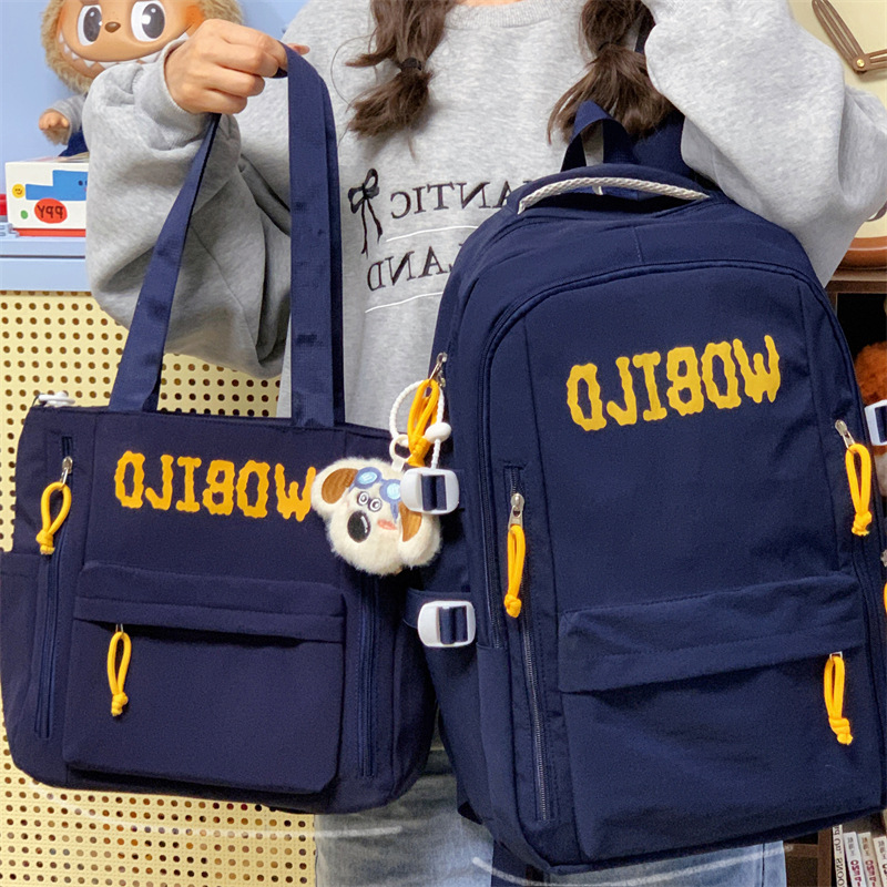 The new Korean-style ins casual and simple letter backpack is a versatile large-capacity shoulder bag for junior and senior high school students to travel easily full figure