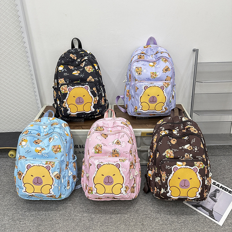The 2025 new Capibarra cute printed cartoon schoolbag is a fashionable lightweight backpack for boys, girls and students full figure