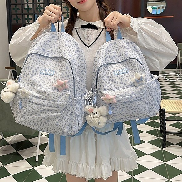 A new high-appearance-level Japanese ins fresh and sweet leopard print mini backpack with large capacity for junior and senior high school students full figure