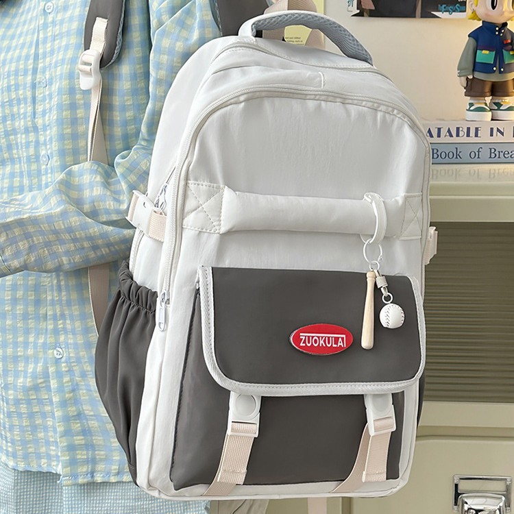 A new 2025 large-capacity multi-compartment Korean-style color-blocking backpack for junior and senior high school students, a versatile and casual commuting backpack full figure