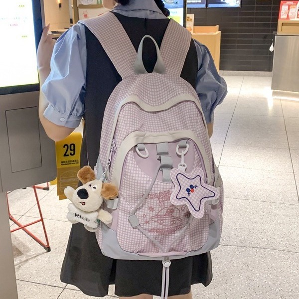 A schoolbag for a female junior high school student with a high level of appearance, a niche forest-themed large-capacity Korean style Instagram color-blocking backpack that is versatile for primary school students full figure