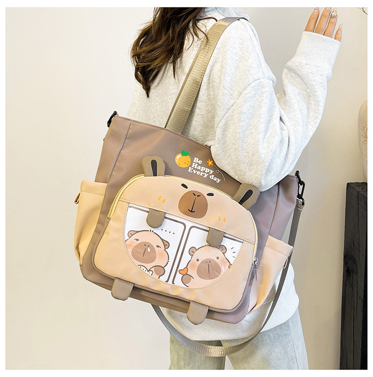 New 2025 large-capacity cartoon student tutorial bag with contrasting colors, cute single-shoulder bag, versatile for commuting, casual crossbody bag details Picture