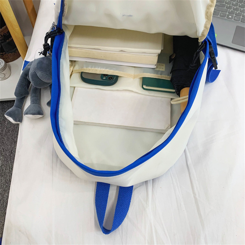 A simple and stylish backpack for a girl's college birthday, a trendy brand with contrasting colors, and a couple's high school backpack for middle school students Application Scenario