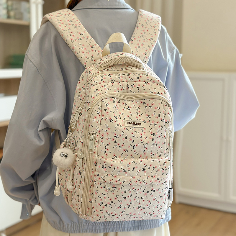A new Japanese-style ins high-appearance-level fresh and sweet small floral backpack, a lightweight and large-capacity backpack for junior and senior high school students full figure