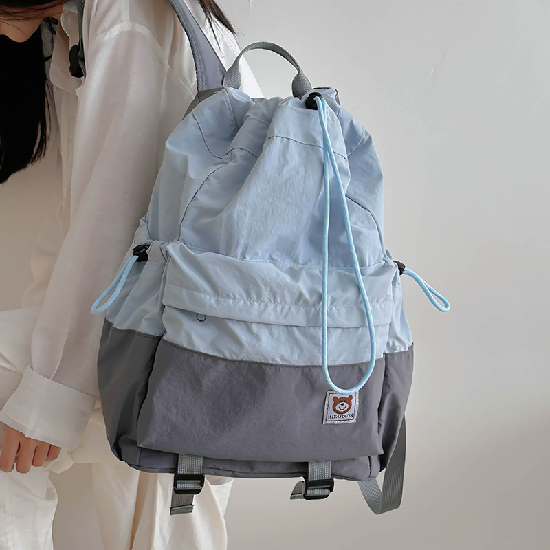The new backpack 2024 is a lightweight and casual backpack with a mountain style and a high level of appearance. It is a color-blocking, drawstring, and outdoor sports backpack full figure