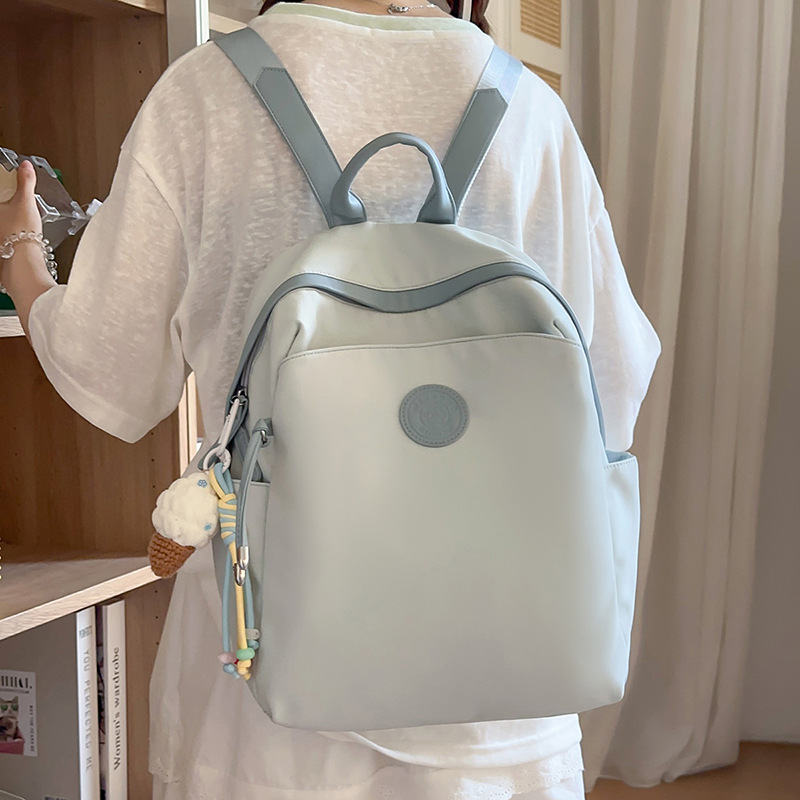 The new summer style of cute and girlish dopamine mini backpack is a versatile and casual backpack for college students' classes full figure