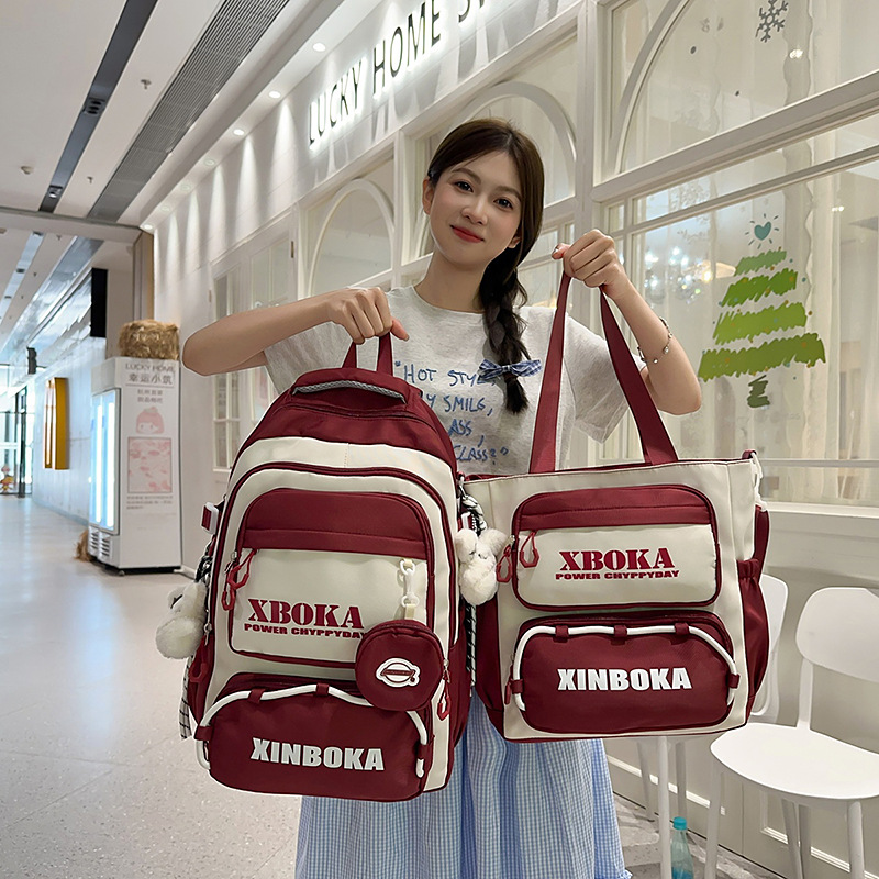 A new Korean-style backpack with a high aesthetic level and a college style, featuring letters, is a casual, simple, lightweight and versatile backpack for junior and senior high school students full figure