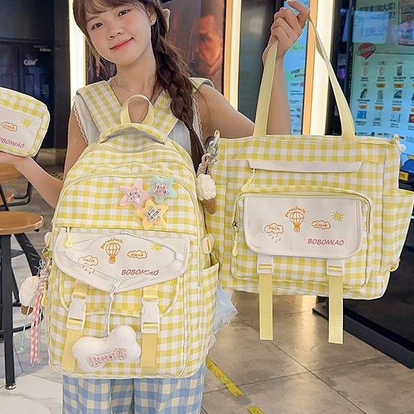A new high-appeal, fresh and sweet checkered tutorial bag for junior and senior high school students, a simple, lightweight and large-capacity three-piece backpack full figure